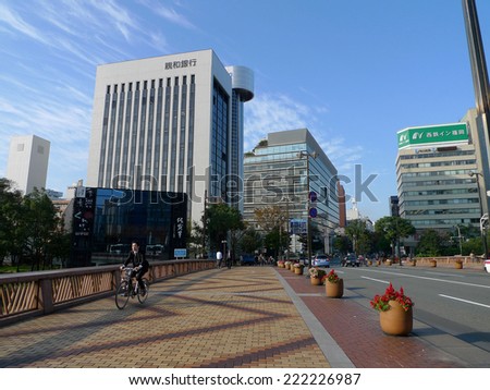 Fukuoka, Japan - Nov 7, 2011 - An unidentified man rides his bike to work in downtown of Fukuoka city ,Japan