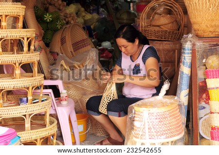 Chonburi, Thailand - Oct 18, 2014 - an unidentified woman works on basket making at Panusnikom district, Chonburi where is the famous town for basketry in Thailand