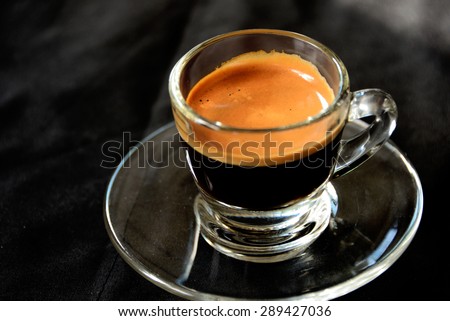 hot espresso shot on black background