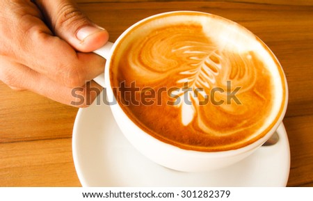 drinking a cup of hot coffee Latte
