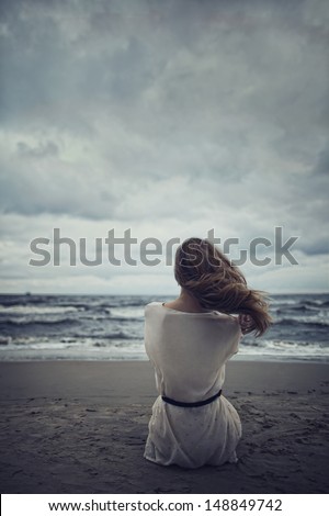 Beautiful Alone Girl On The Beach