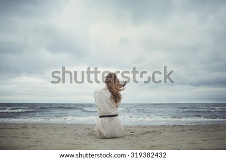beautiful alone sensual girl on the beach