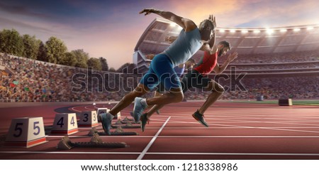 Male athletes sprinting. Three men in sport clothes run at the running track in professional stadium