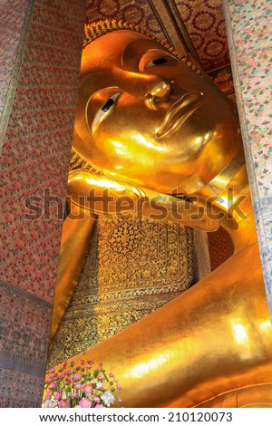 Reclining buddha gold statue face  Wat Pho temple bangkok Thailand