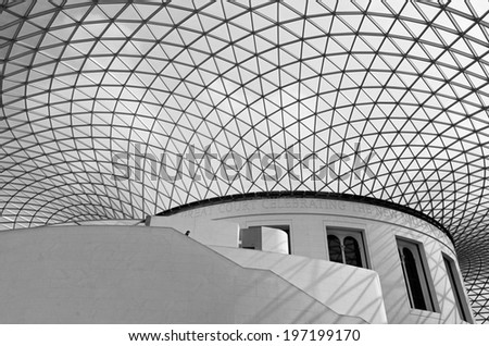 LONDON - MARCH 24: A lonely tourist walks down the stairs of the Great Court of the British Museum in London, on March 24, 2014.