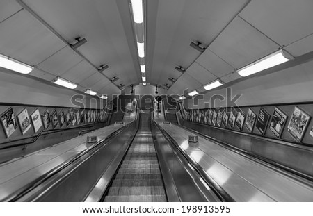 LONDON - MARCH 23: Empty escalator deep in the network of tunnels of the London Underground, UK, on March 23, 2014.