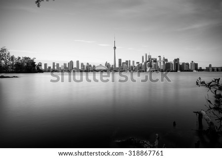 Long exposure of Toronto skyline with Lake Ontario in the foreground, as seen from Center Island.