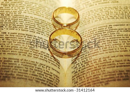 stock photo Stylized Wedding Rings on a Bible