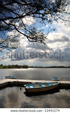 small boats wait for anglers on Ballyhonock Lough, Co.Cork, Ireland