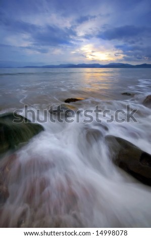 water rushing towards shore at Rossbeigh Strand, Co.Kerry, Ireland