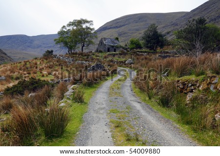 gravel road leading to direlict house in The Black Valley, Co.Kerry, Ireland reminds of times past