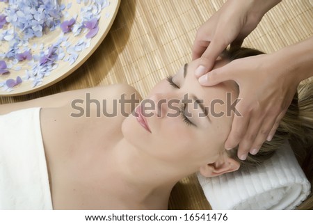 Woman in a day spa getting a deep tissue massage therapy