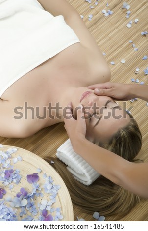 Woman in a day spa getting a deep tissue massage therapy