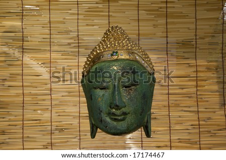 Thailand. Chiang Mai. Buddha\'s face carved in wood in  Buddhist temple.