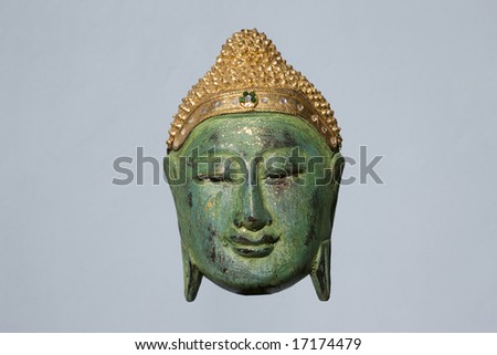 Thailand. Chiang Mai. Buddha\'s face carved in wood in  Buddhist temple.