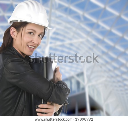 A pretty woman architect on the building construction site