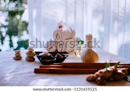 Thai herbal spa elements setting for traditional Thai massage, tropical spa treatment background concept.