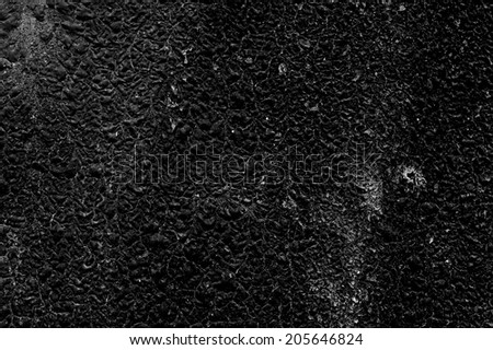 Texture of the old black roofing material close-up