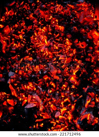 Bright sparkling embers in a brazier as background