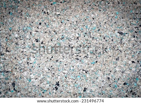 Background of small blue, gray, white and black small granules with vignetting effect as background