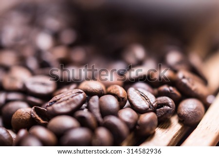 Roasted coffee beans, can be used as a background, blurry background