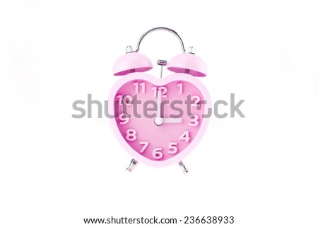 pink heart clock with bell on white background,three o'clock