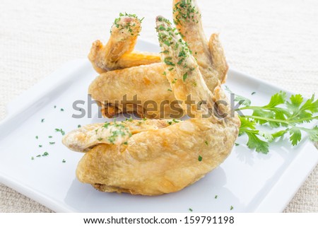Chicken wings Fried in white dish on table