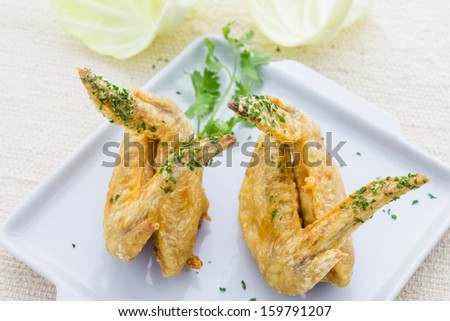 Chicken wings Fried in white dish on table