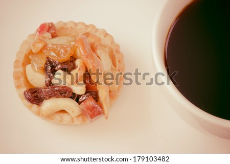 vintage black coffee and Fruit Tart  on wooden table