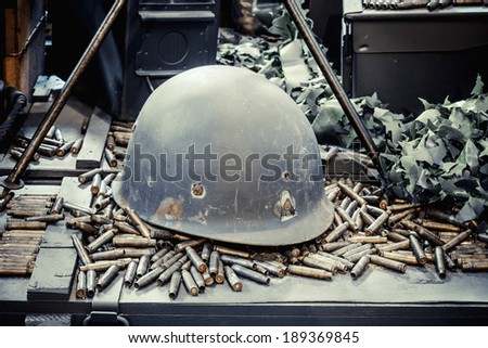 Old military helmet and bullets