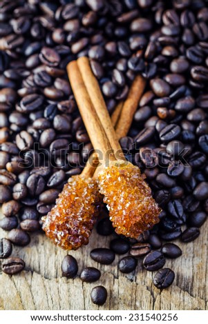 Sugar Stick Cinnamon and coffee bean on wooden table