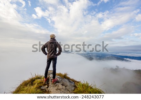 Man on top of mountain. Phu cheefa park Chiangrai Thailand