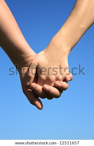 Couple holding by hands
