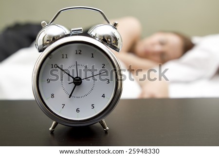 Woman in bed trying to wake up