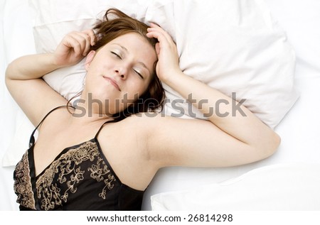 Womant in bed trying to wake up