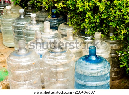 Empty damaged plastic water bottles. Many indians do not have access to clean drinking water an must rely on locally bottled water for consumption