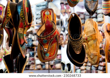 Traditional mojari shoes (Juttis) of various designs on display. These are shoes made from leather and decorated with various elements for royalty