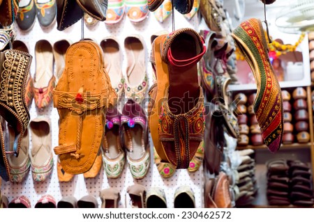 Traditional mojari shoes (Juttis) of various designs on display. These are shoes made from leather and decorated with various elements for royalty