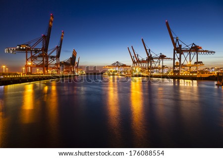 Container harbor at night in Hamburg Germany Container harbor at night in Hamburg Germany