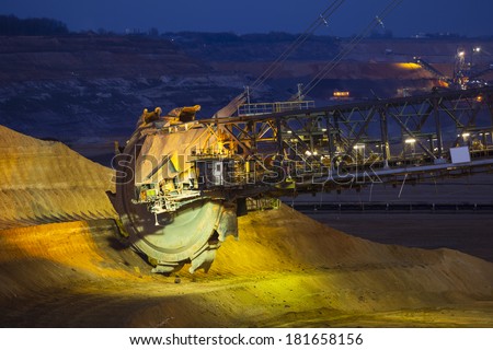 A giant Bucket Wheel Excavator in a lignite pit mine at night