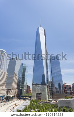 New York City - June 23: The almost finished One World Trade Center and memorial site in New York with blue sky  on June 23, 2013