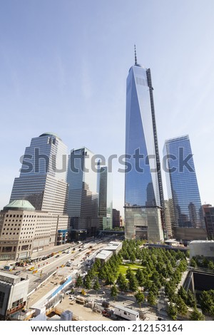 New York City - June 22: The almost finished One World Trade Center and memorial site in New York with blue sky  on June 22, 2013
