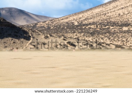 Flying sand in the famous lagoon at Playas de Sotavento, Fuerteventura during low tide