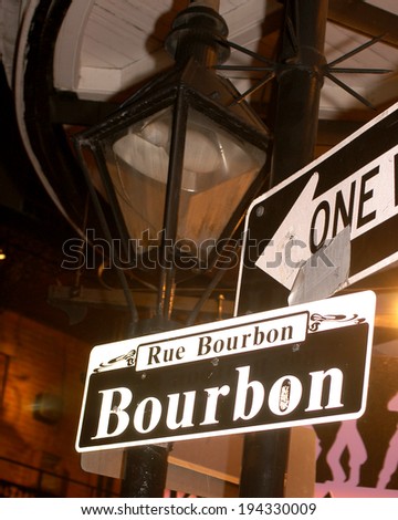 Bourbon street gas lamp and street sign.