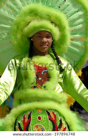 March 28, 2010 - New Orleans, Louisiana: A Mardi Gras Indian displays her costume at the annual \