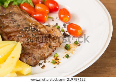Beef steak medium grilled, on dish