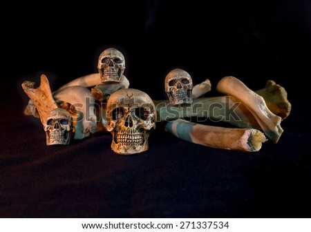four skull with pile of bone, On dark atmosphere