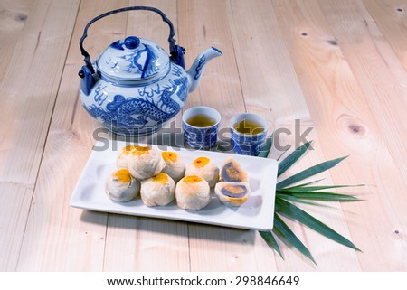 Chinese Pastry and chinese tea on wooden table