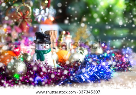 Decoration merry christmas and happy new year on snow fall night / select focus