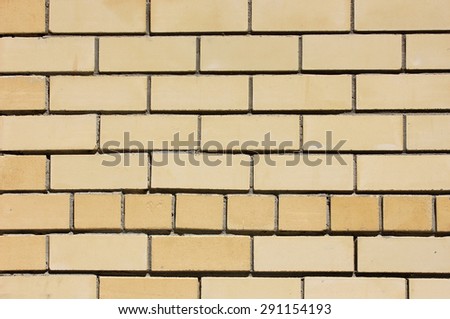 House wall element from a yellow brick
